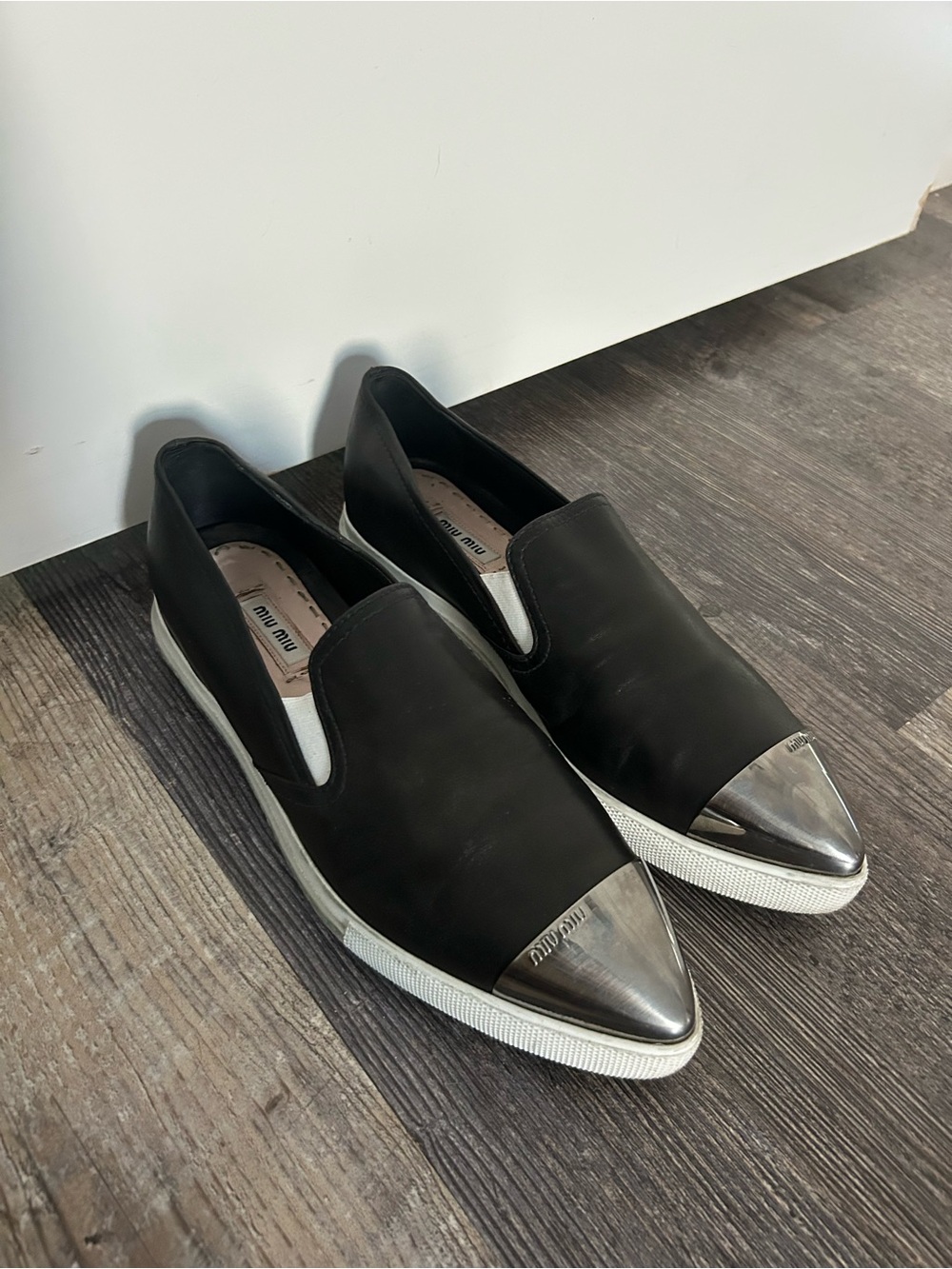 Miu Miu Black Slip-On Sneakers with Metallic Silver Cap Toe